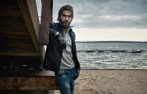 Handsome bearded man at beach with hair blowing in breeze - Wicked Beard Company